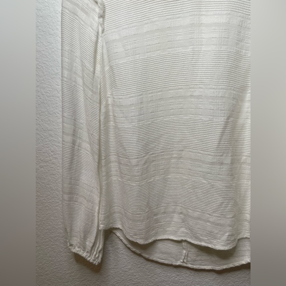 Reformation Cream Mock neck long sleeve blouse xxs
Purchased from The Real Real - Picture 4 of 14